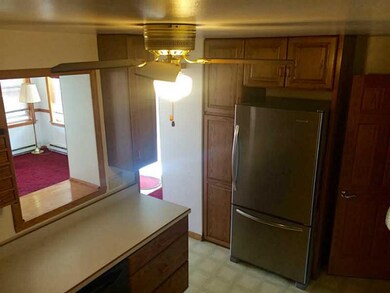 Kitchen. oak cabinets, peak thru to family room