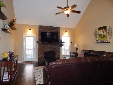 LIVING ROOM WITH STACK STONE GAS FIREPLACE, WOOD F