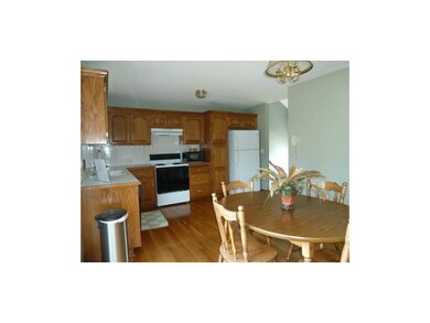 Large eat in kitchen includes refrigerator.