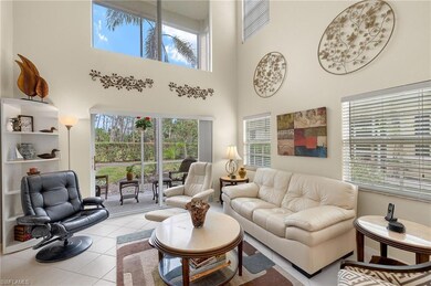 Living room with light tile patterned floors and a