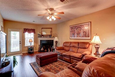 Laminate hardwood, neutral colors, ceiling fan, lo