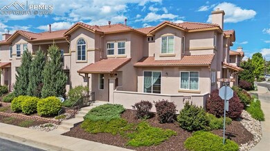 Mediterranean / spanish home featuring a tiled roof, stucco siding, and a chimney
