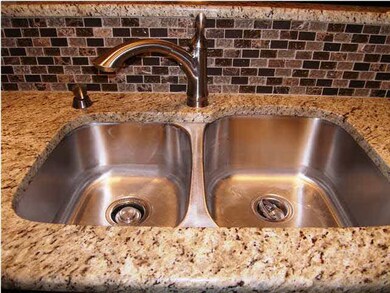 Deep submount sink, granite slabs, and glass block