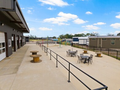 Surrounding community featuring outdoor dining area and a patio
