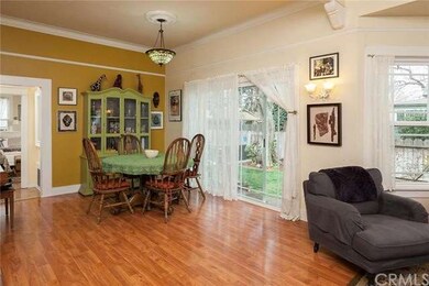 Dining room with large glass to side yard.