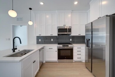 Kitchen featuring stainless steel appliances, a s