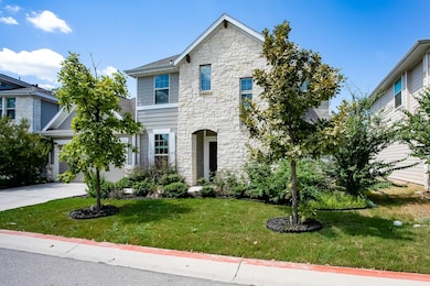 View of front of house with stone siding, a front