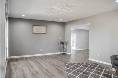 The living room has recessed lighting.