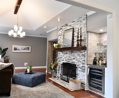 wet bar with wine cooler with see thru fireplace