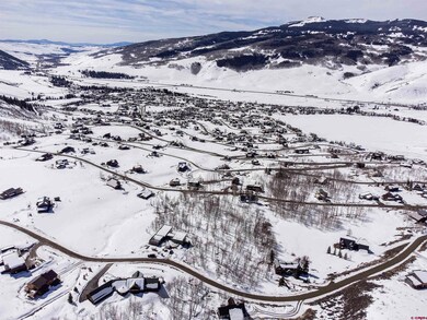 Snowy aerial view with a mountain view