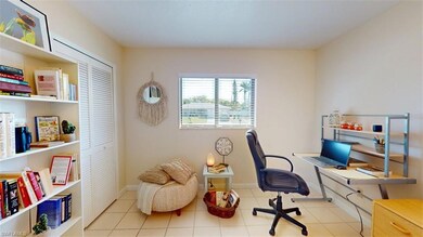Tiled office space featuring baseboards
