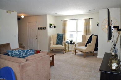 Spacious Living room with bay windows.  Foyer has 