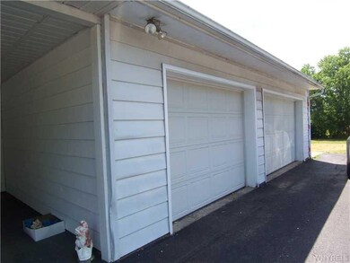 Garage. Oversized 2.5 car garage and Carport.