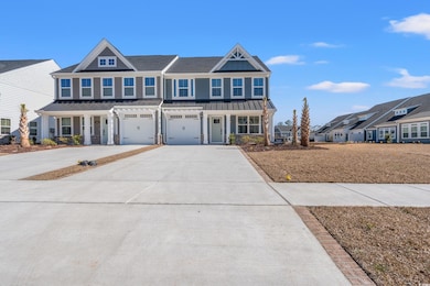 View of front of home featuring driveway and an at