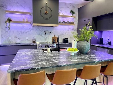 Bar with dark stone countertops, backsplash, gray 