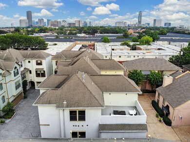 AERIAL VIEW OF PATIO HOME DISPLAYING THE UNIQUE ROOFTOP TERRACE