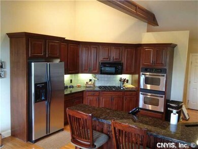 Kitchen. Cherry cabinets with granite counter top.