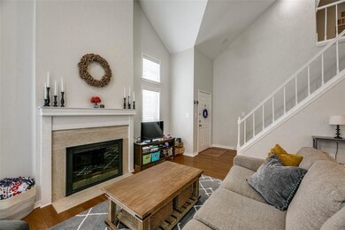 Soaring ceilings in living room with a fireplace