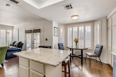 Granite countertops in the kitchen with view of th