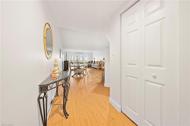 Hall featuring light wood finished floors and baseboards