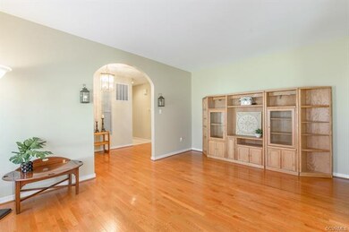 Spacious Living Room with Hardwood Flooring