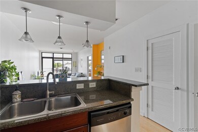 Kitchen with light hardwood / wood-style floors, s