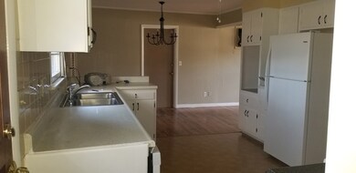 kitchen looking towards dining area with garage ac