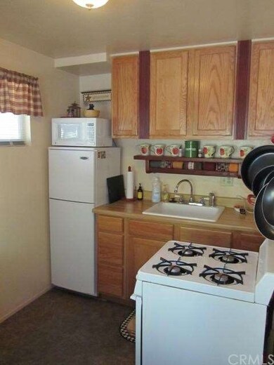 Kitchen with new appliances and kitchen cabinets.