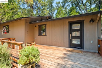 Property entrance with a wooden deck
