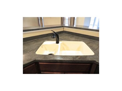 beautiful Corian countertops throughout kitchen
