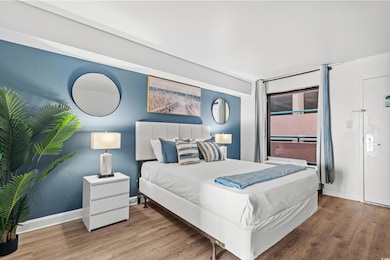 Bedroom featuring light wood-type flooring