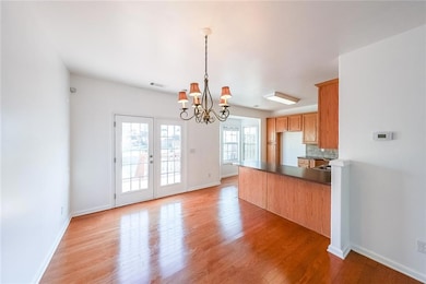Kitchen featuring baseboards, an inviting chandeli
