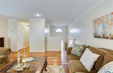 Split level comes up to living room, half bath in 
