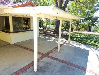 Alternate angle of backyard & covered patio. Kitch
