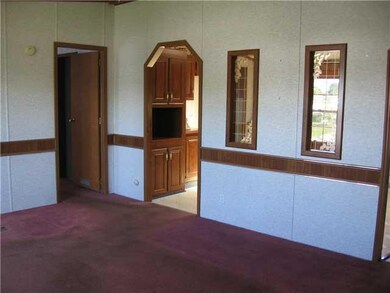 Living Room. The door to the left leads to the mas