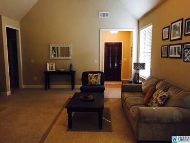 Looking from kitchen to foyer with tiled floor