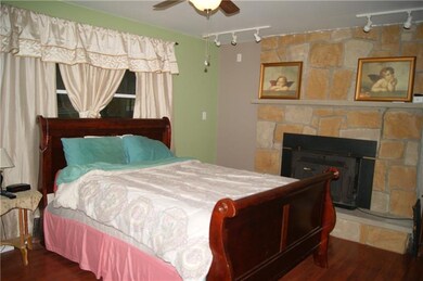 Master Bedroom with stone fire place