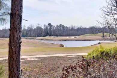 Golf and water views from this end unit condo.