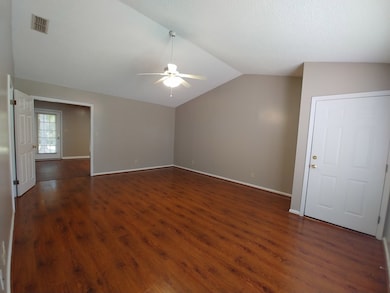 Bright living room with vaulted ceiling