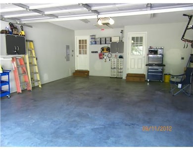 Parking Lot/Garage. Immaculate garage with separate entry door and attic access for storage. Wall-mounted cabinets stay.