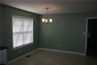 The back side of the Kitchen sports this large eat-in area the will accommodate a large table for family meals and entertainment