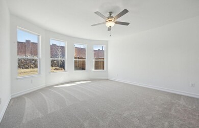Elegant owner's suite with bay window *real home p