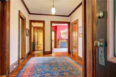 Oversized foyer with period lighting