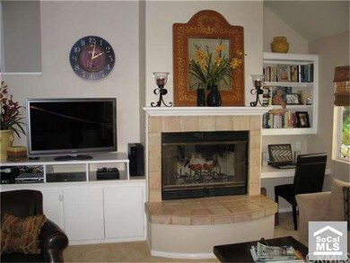 Family room with fireplace, built in book cases