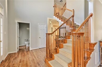 2-story foyer with newly refinished wood floor, fr