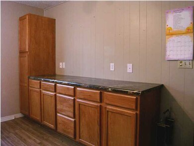 Lots of additional cabinetry storage on east wall 