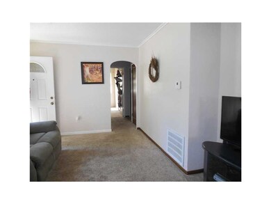 Family Room. Round top doorways lead you to the be