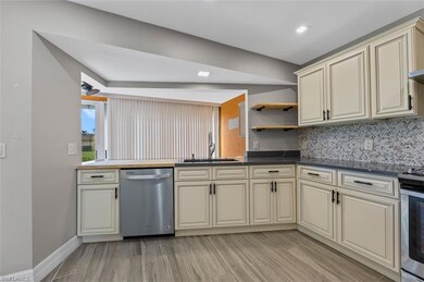 Kitchen has view of the bonus area and backyard