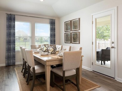 Dining area with plenty of natural light, wood fi