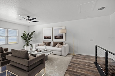 The room features high vaulted ceilings and large windows that fill the space with natural light, emphasizing the spacious feel. The sleek, wood-look flooring adds warmth and elegance to the room, complementing the clean, white walls perfectly. Please note that some of the photos are virtually staged to offer you the best possible view of your future home This loft features high vaulted ceilings and large windows that fill the space with natural light, emphasizing the spacious feel. The sleek, wood-look flooring adds warmth and elegance to the room, complementing the clean, white walls perfectly. Please note that some of the photos are virtually staged to offer you the best possible view of your future home This loft features high vaulted ceilings and large windows that fill the space with natural light, emphasizing the spacious feel. The sleek, wood-look flooring adds warmth and elegance to the room, complementing the clean, white walls perfectly